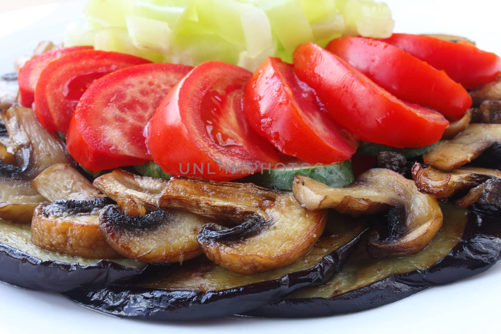Fried eggplant and mushrooms with fresh tomatoes, cucumbers and pepper