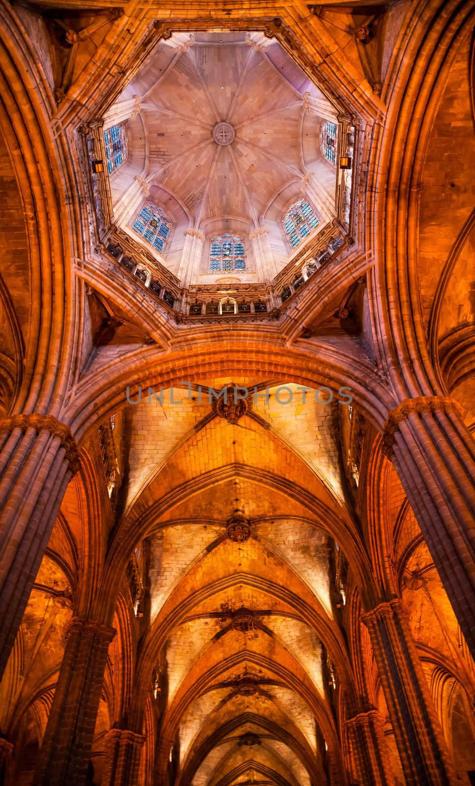 Gothic Catholic Cathedral Basilica Dome Stained Glass Stone Columns Barcelona Catalonia Spain.  Built in 1298.