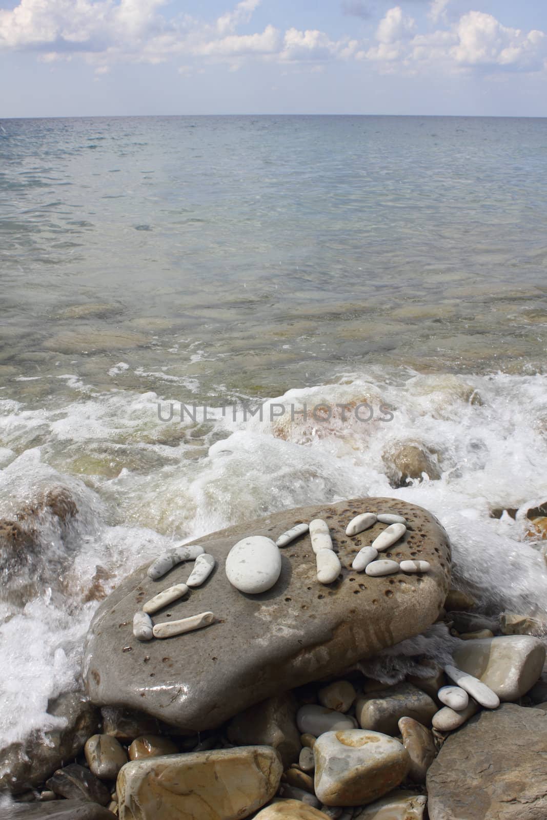 Digits 2012 on stone sea coast