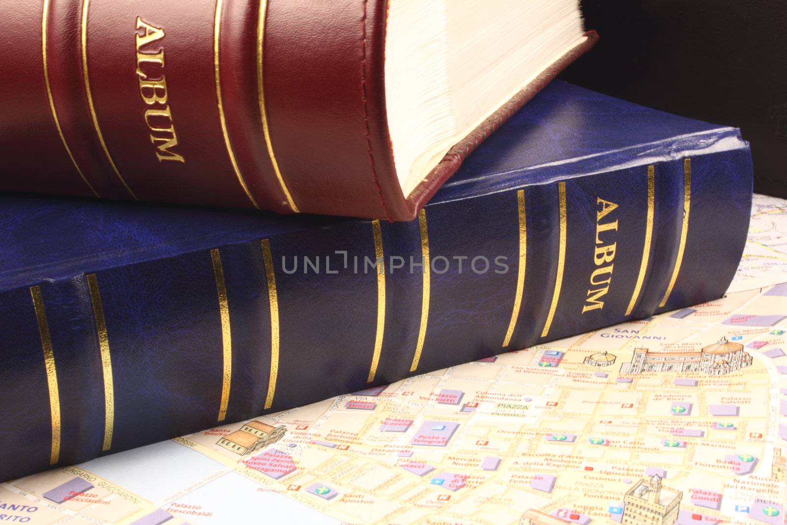 Two Photoalbums on city map.