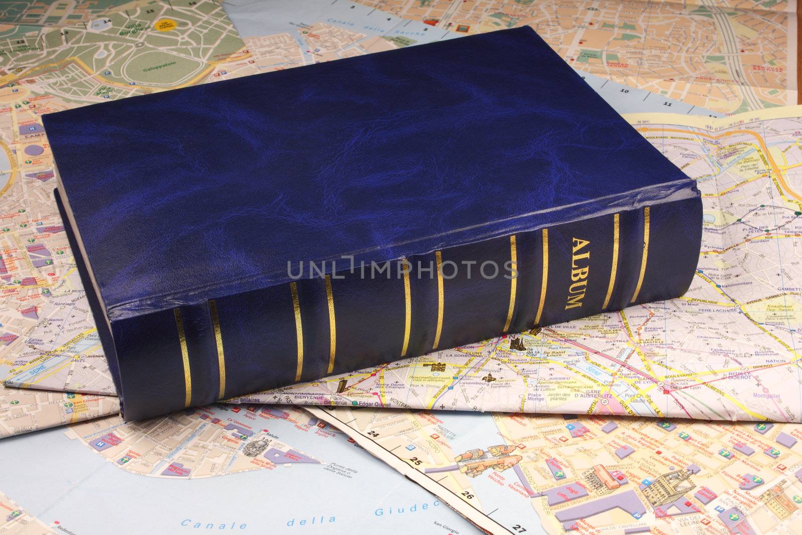 Blue photoalbum on map background.