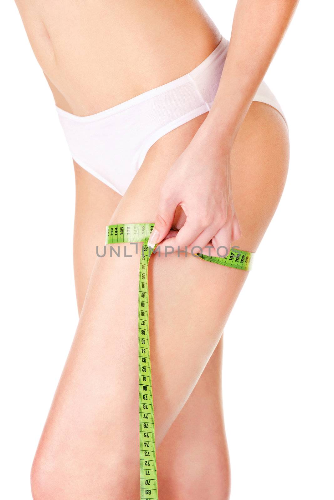 Measure tape around slim woman's leg, isolated on white. Health concept