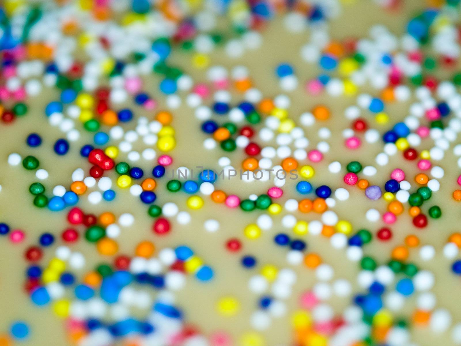 Cookie and Cake Icing and Rainbow Colored Sprinkles