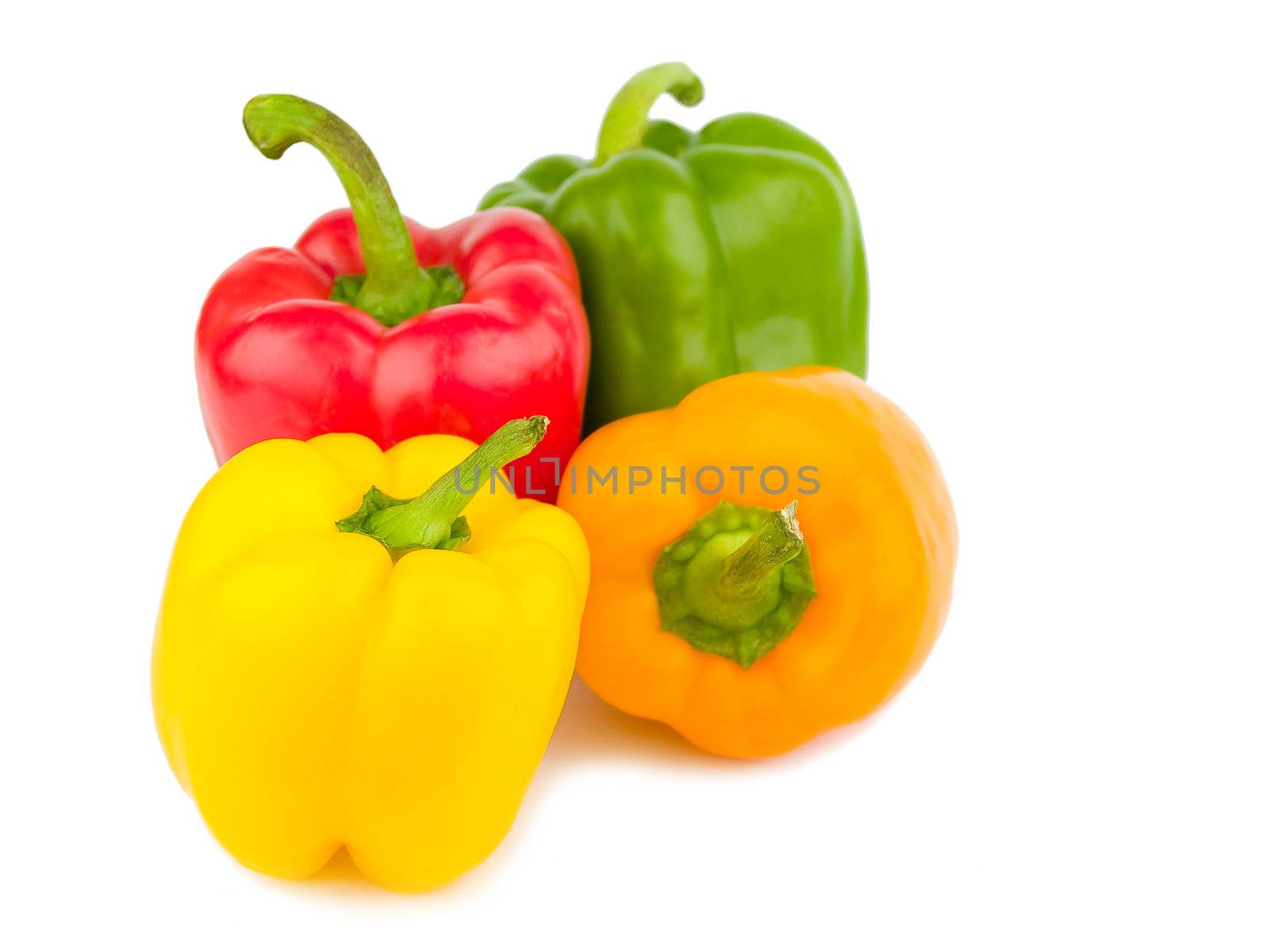 Four Colorful Bell Peppers Isolated on White