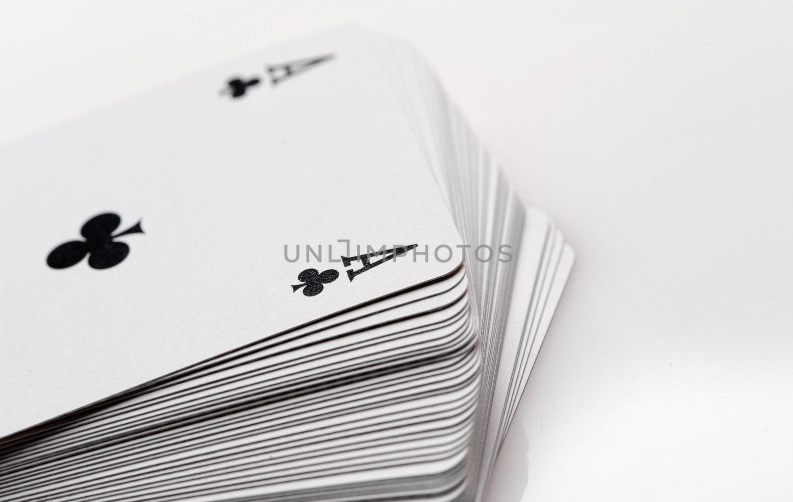 close up of playing cards poker game on white background by stokkete
