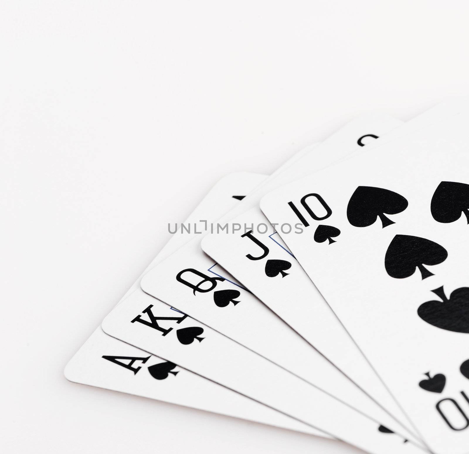 Royal flush of spade on white background  by stokkete