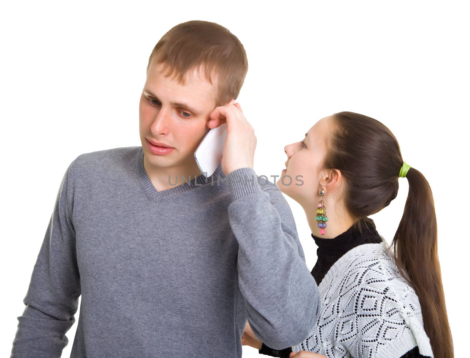 Boy and girl talking on a cell phone. Isolated on white background.