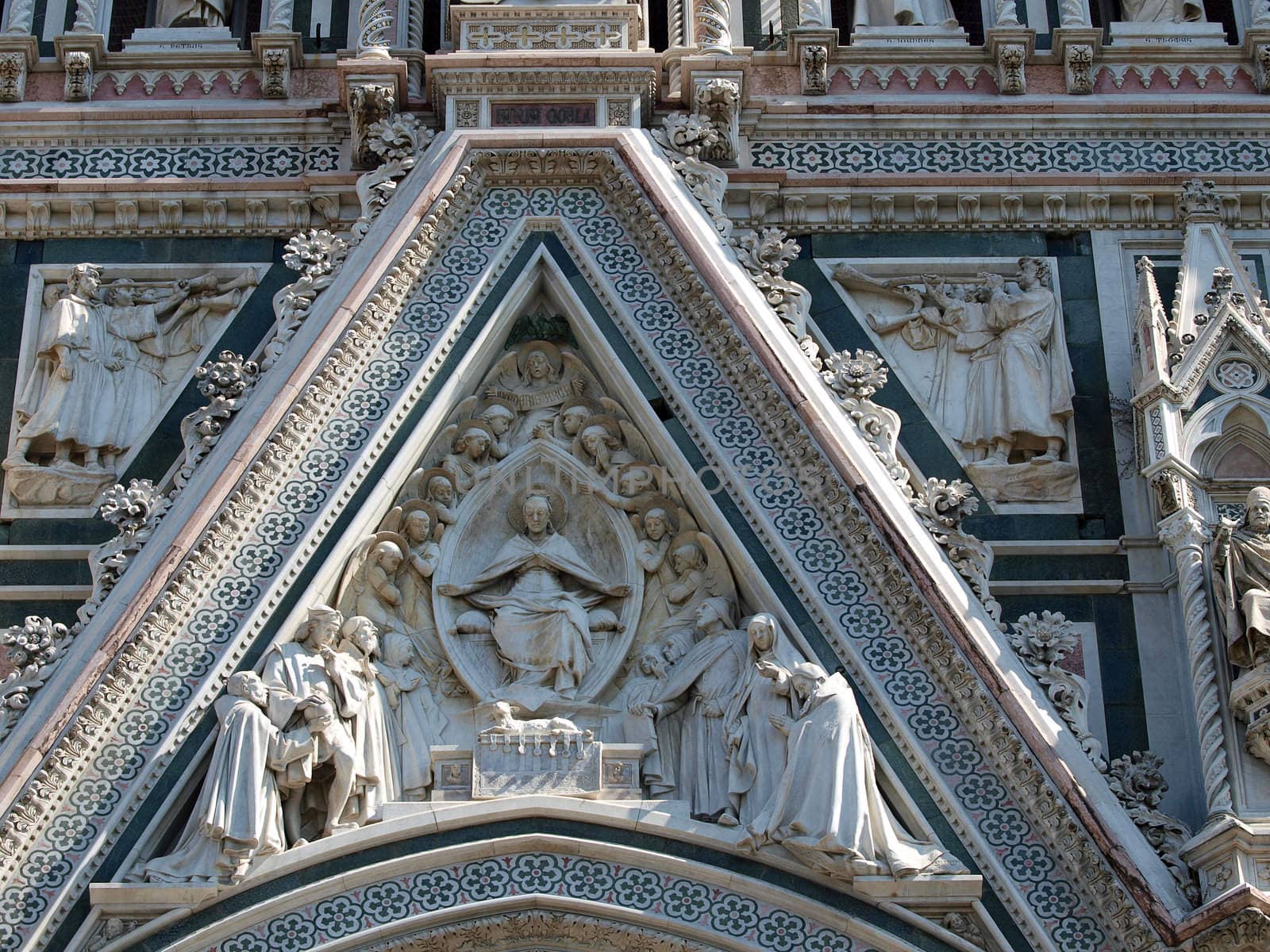 Florence - beautiful composition with  Virgin Mary above the portal on the facade of the Santa Maria del Fiore cathedral
