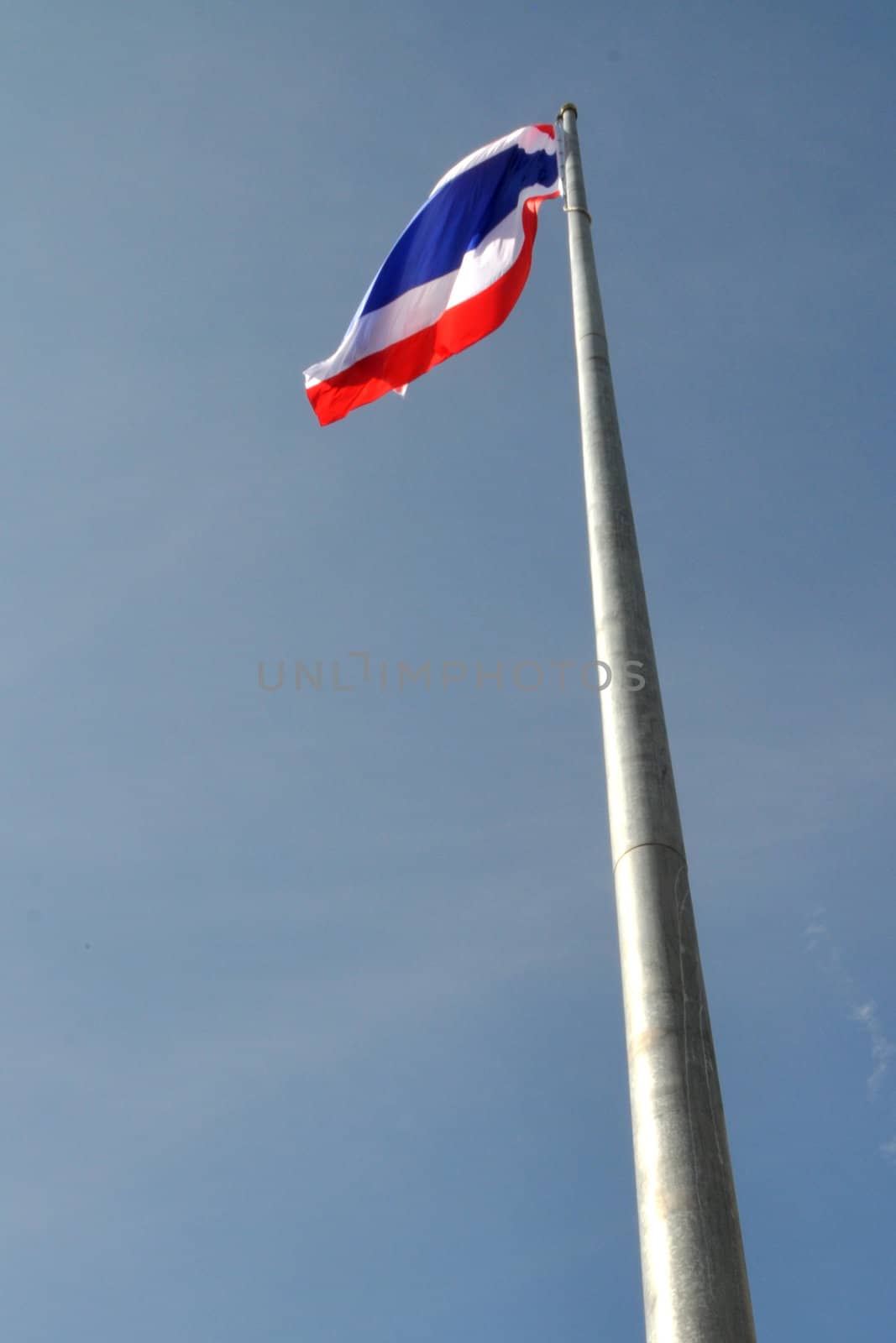 Flag of Thailand Against a Blue Sky