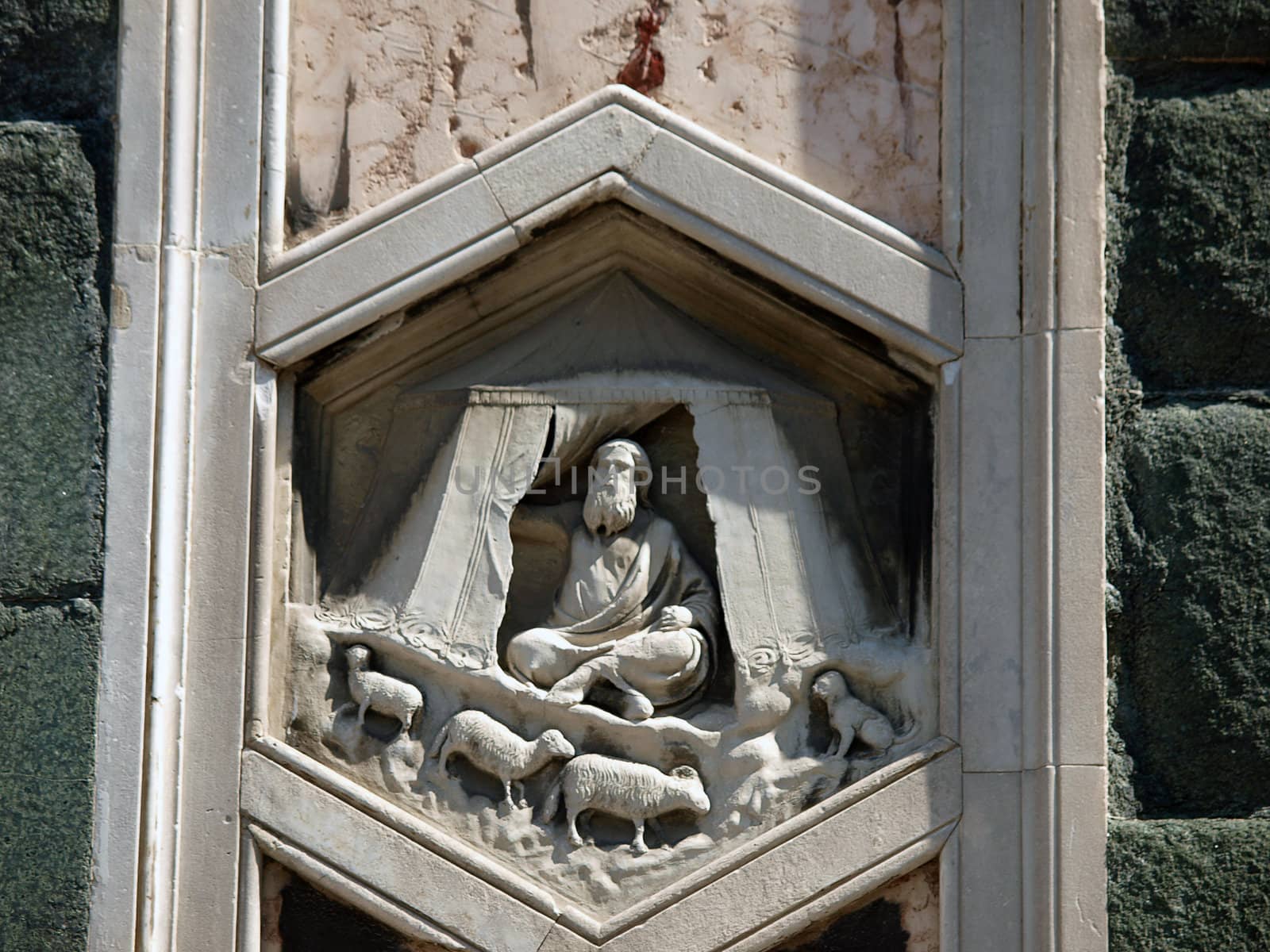 Florence - The hexagonal Relief on the Giottos' Campanile.The hexagonal panels on the lower level depict the history of mankind, inspired by Genesis.