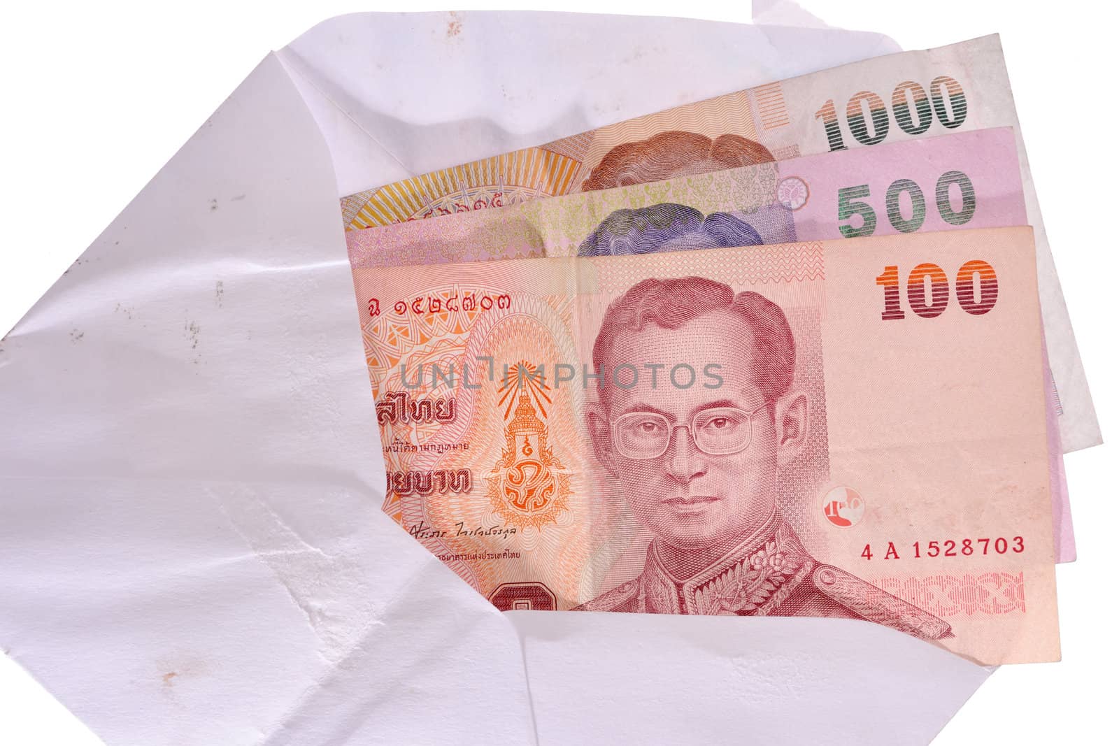 banknotes in an envelope isolated on a white background