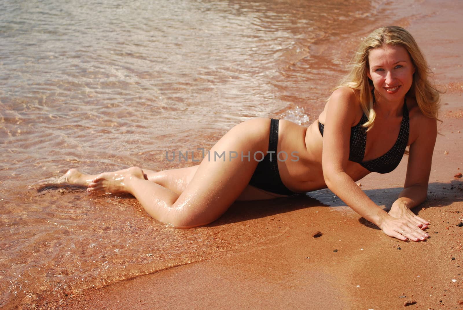 blond smiling women on the beash