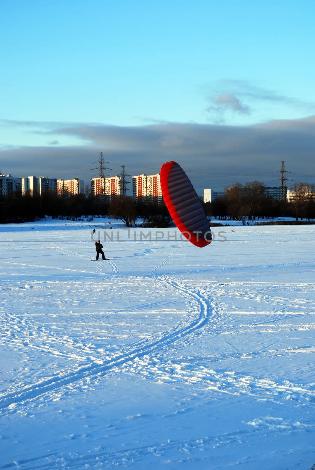 snowkiting on a frozen lake 