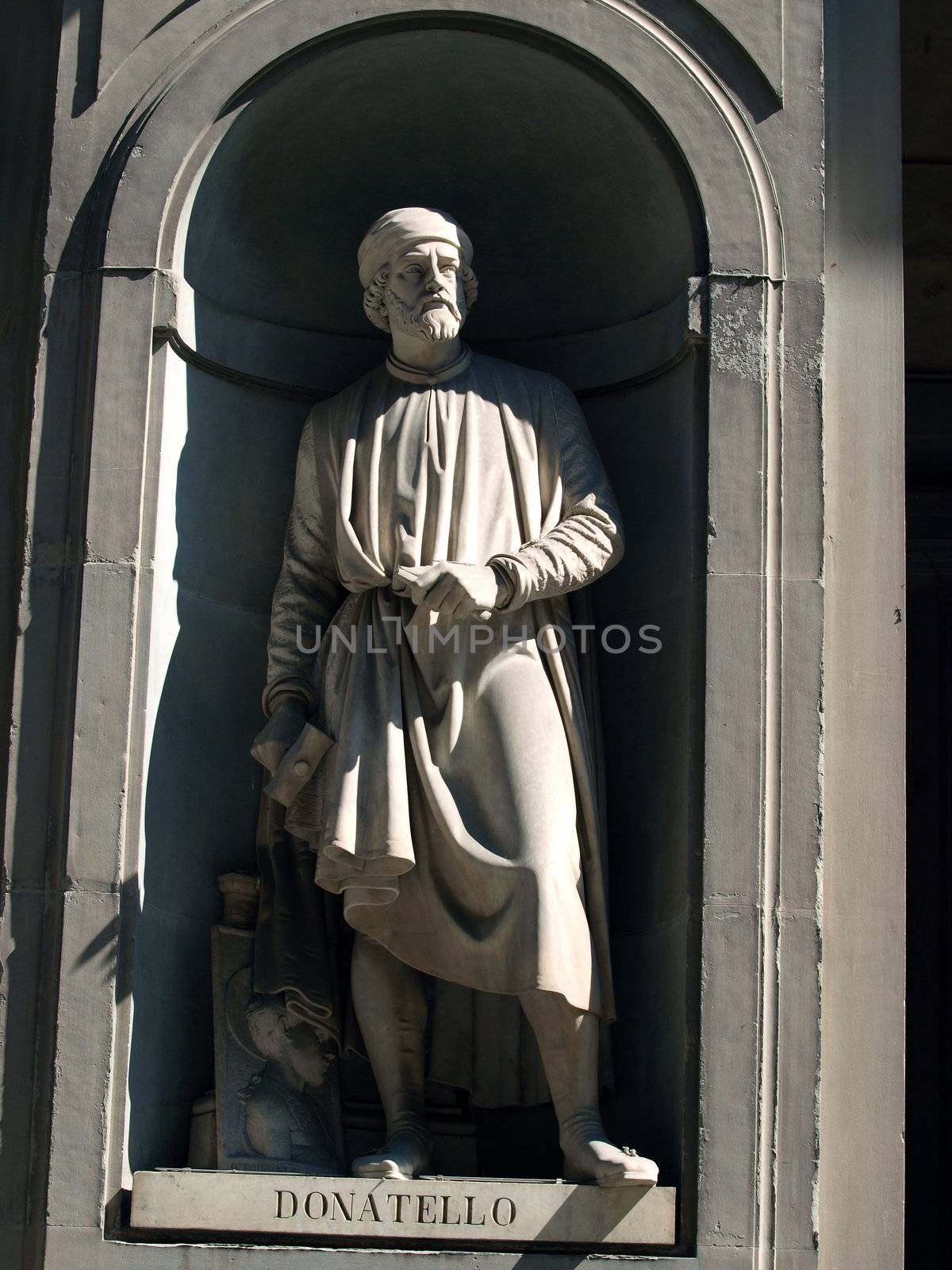 Donatello in the Niches of the Uffizi Colonnade, Florence. The niches beneath the porticos of the Uffizi Gallery were originally designed by Vasari purely as architectural features but by the first half of the 19th Century they were occupied by 28 statues of famous people from the worlds of politics, art, literature, science, the judiciary and also religious figures.