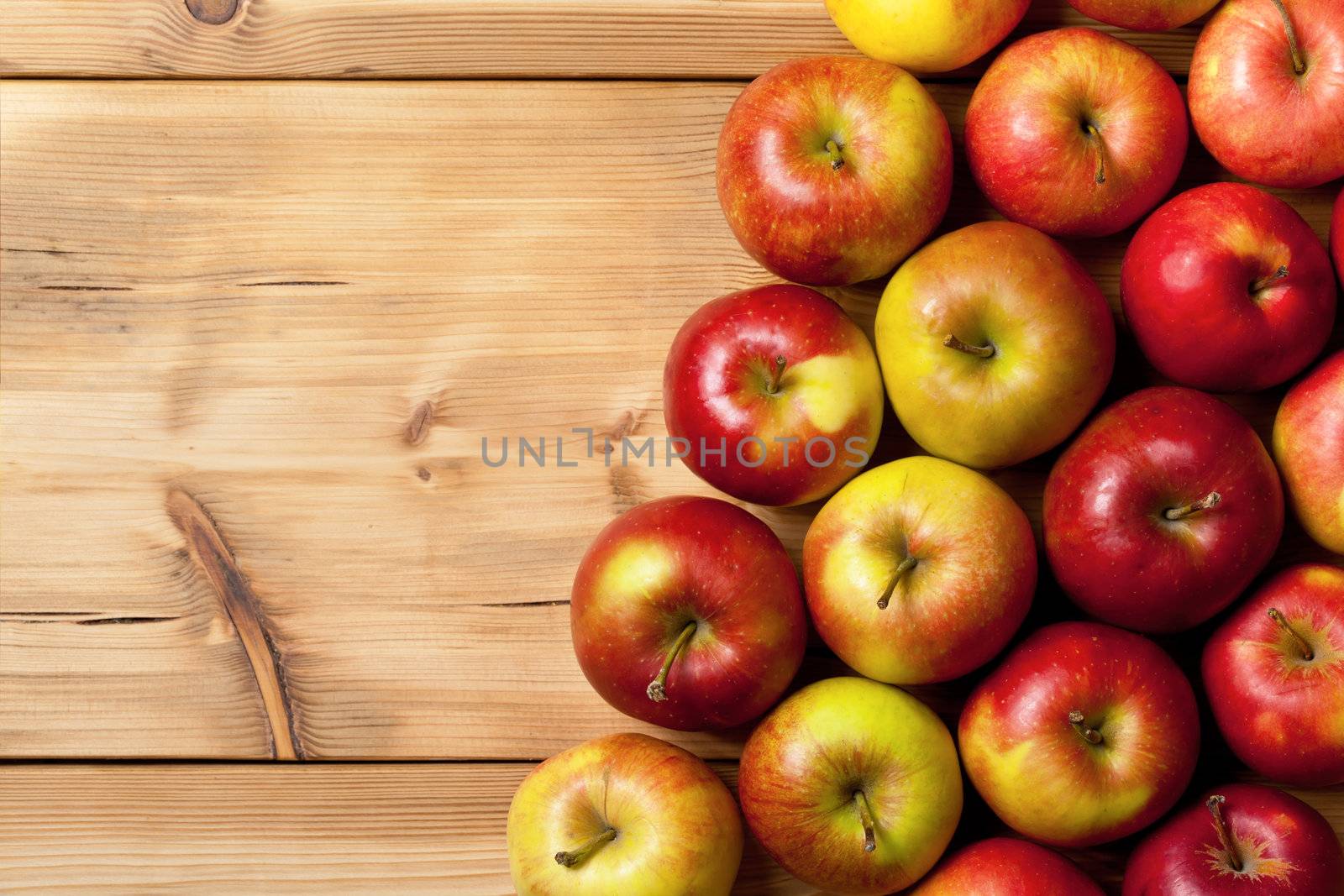 Apples on wooden table, top view nature background with copy space