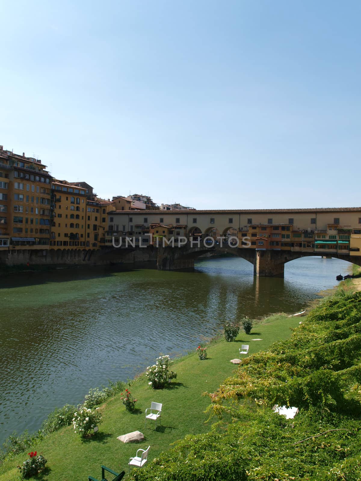 Florence - View of the Ponte Vecchio. The Ponte Vecchio /Old Bridge/ is a Medieval bridge over the Arno River, in Florence, Italy