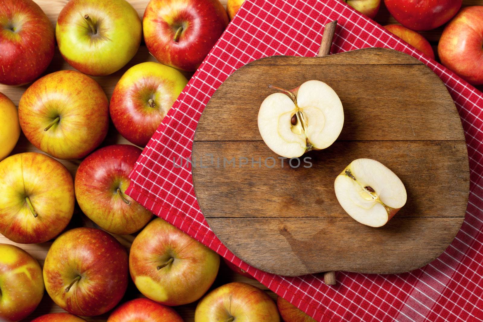 Apples composition with fruits and cutting board with apple shape. Top view