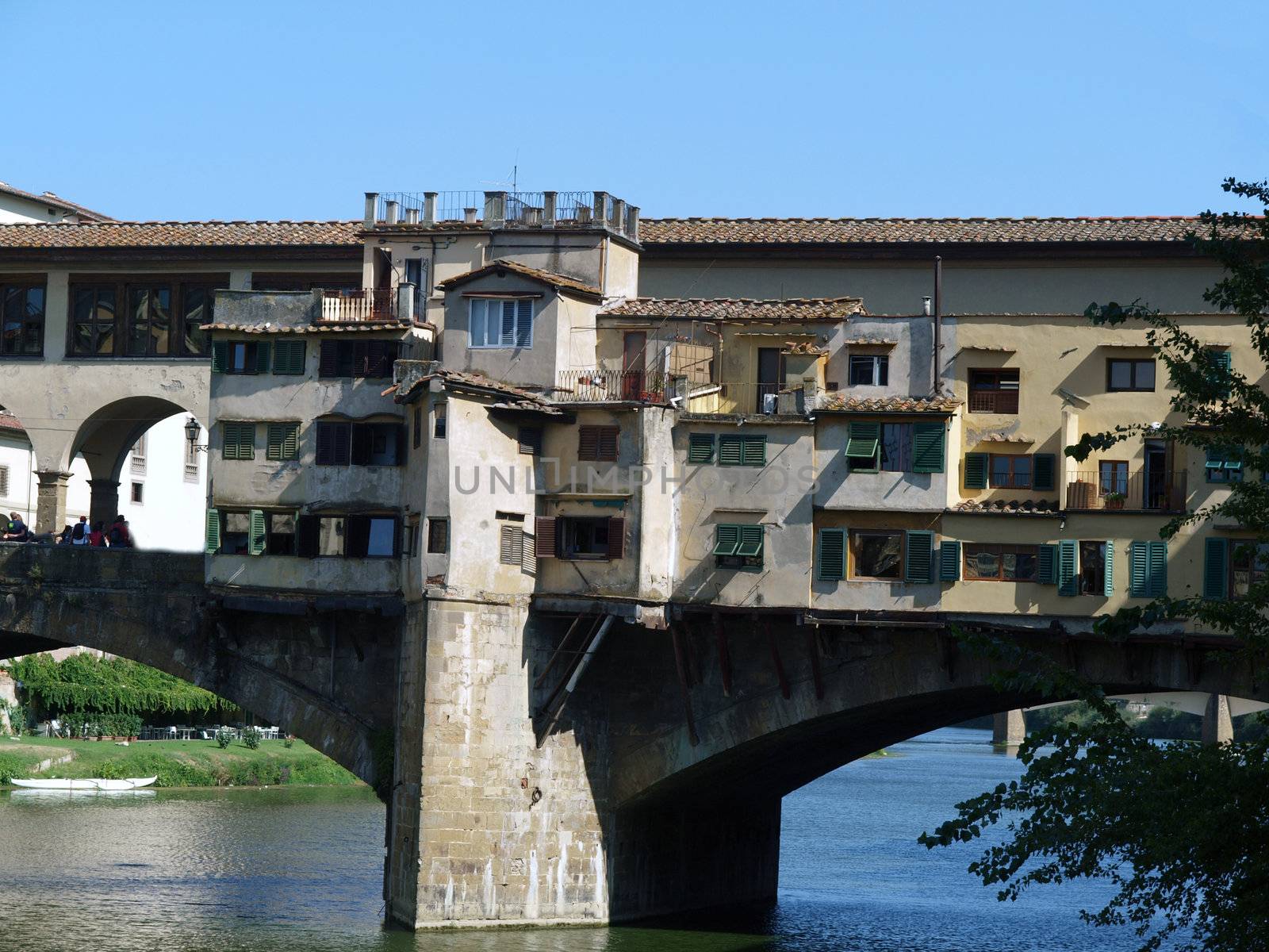 Florence - View of the Ponte Vecchio. The Ponte Vecchio /Old Bridge/ is a Medieval bridge over the Arno River, in Florence, Italy