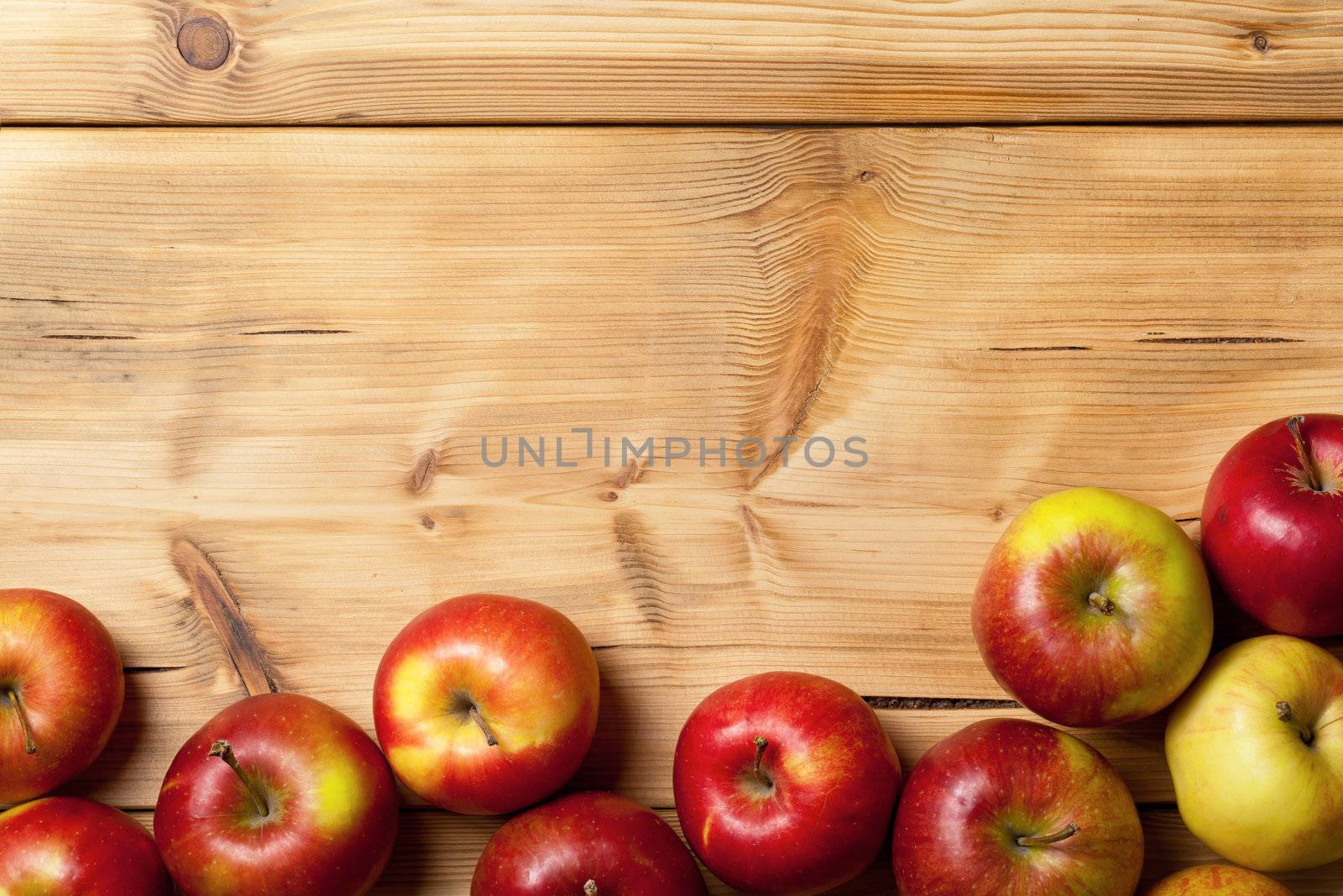 Apples on wooden background. Fresh fruits frame with copy space