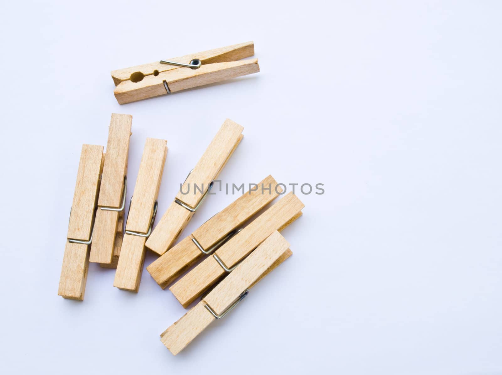 Wooden clothes clips isolated on white back ground