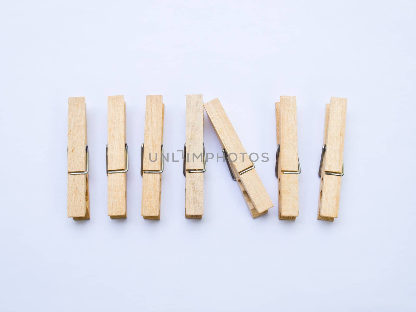 Wooden clothes clips isolated on white back ground