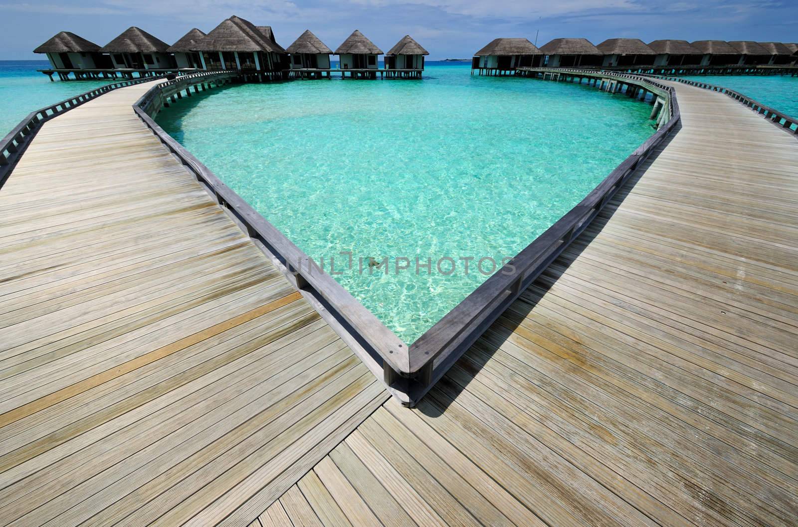 Beautiful beach with water bungalows at Maldives