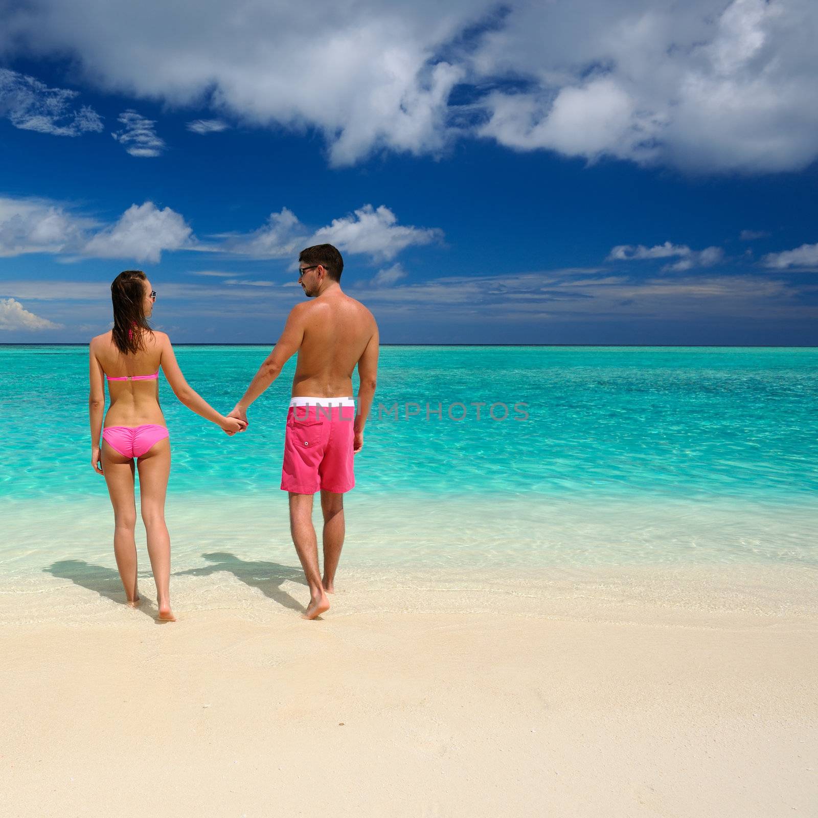 Couple on a beach at Maldives by haveseen