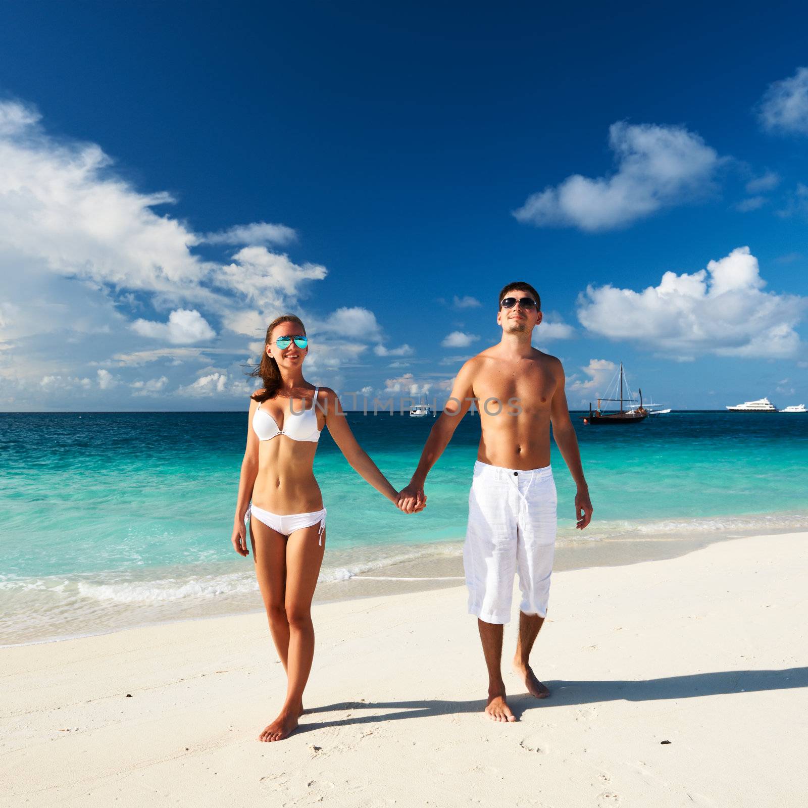 Couple on a tropical beach at Maldives