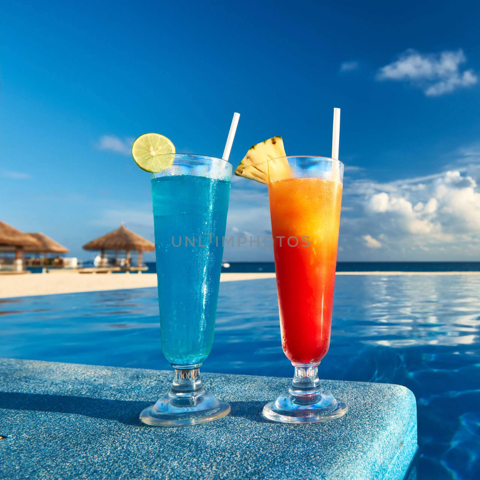 Cocktails near swimming pool by haveseen