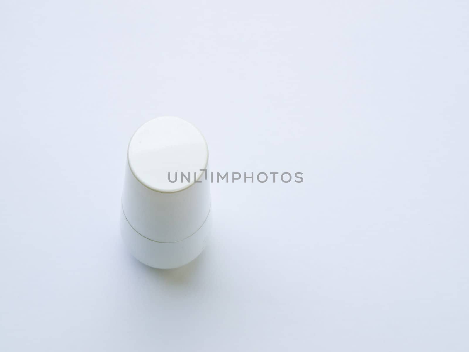 A white plastic bottle isolated on white background