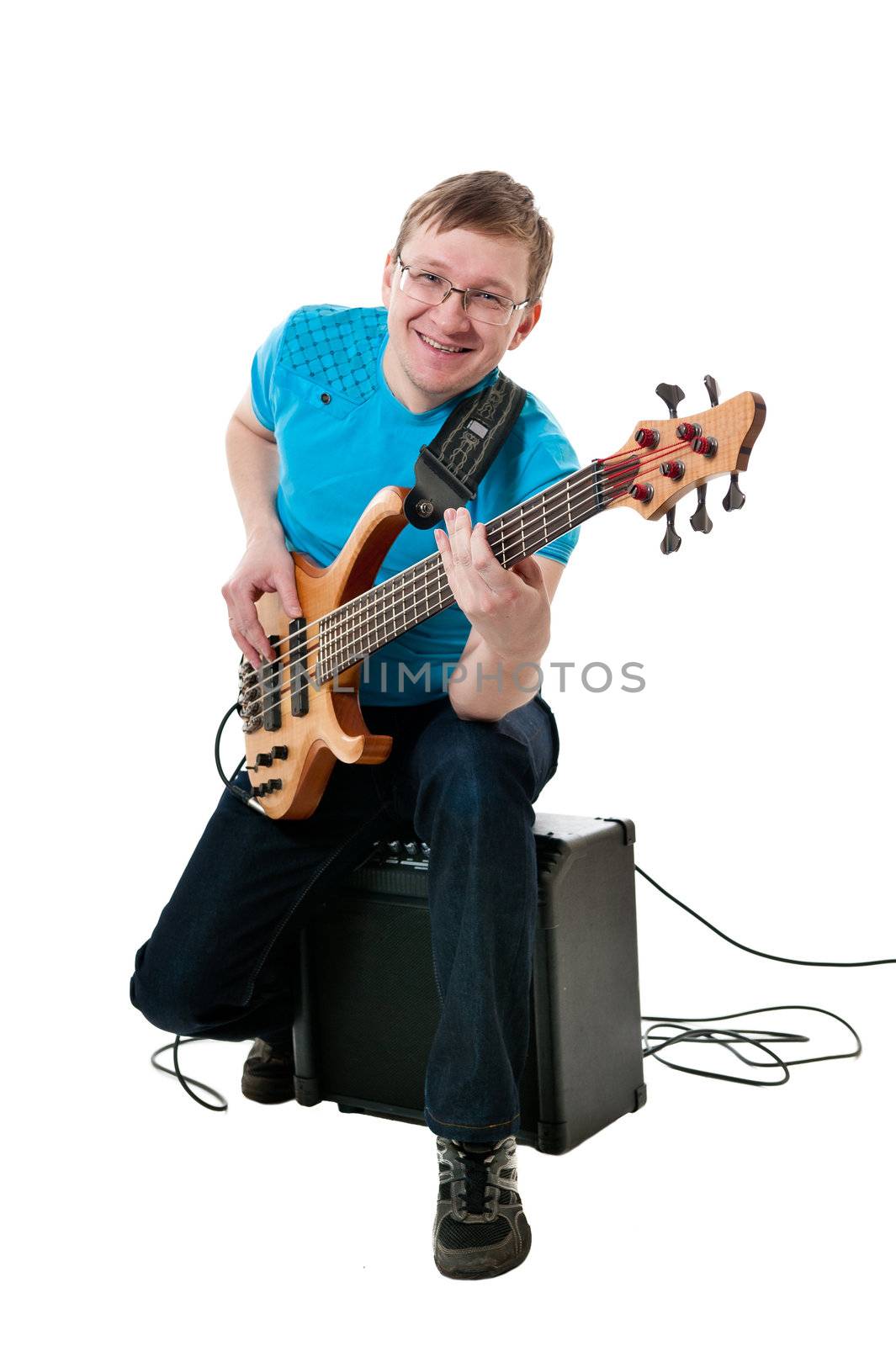 Young guitarist with electro guitar on white background