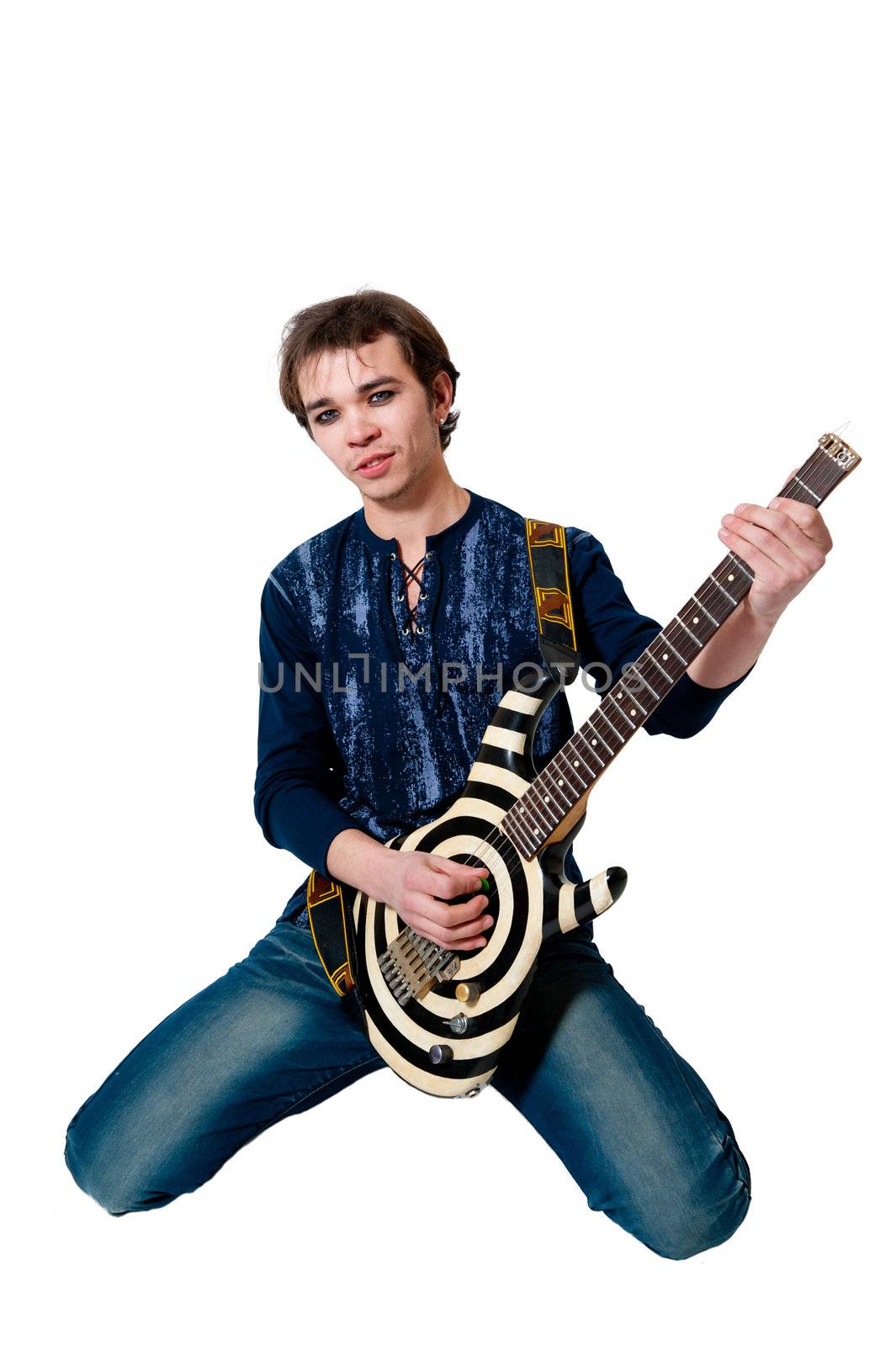 Young guitarist with electric guitar on white background