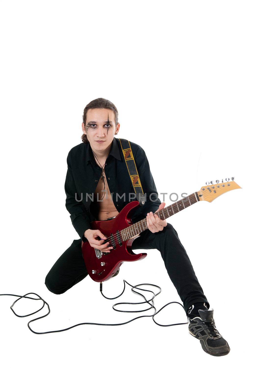 Young guitarist with red guitar on white background