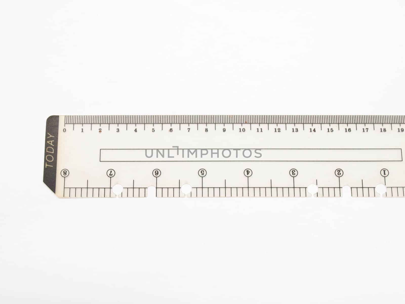 Closeup of used plastic ruler isolated on white background