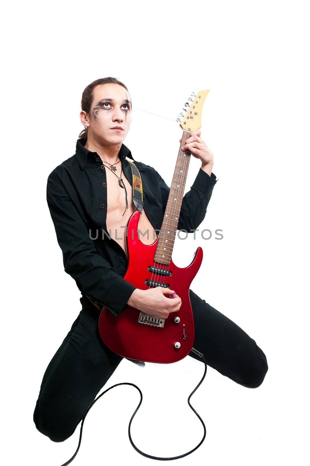 Young guitarist with red guitar on white background