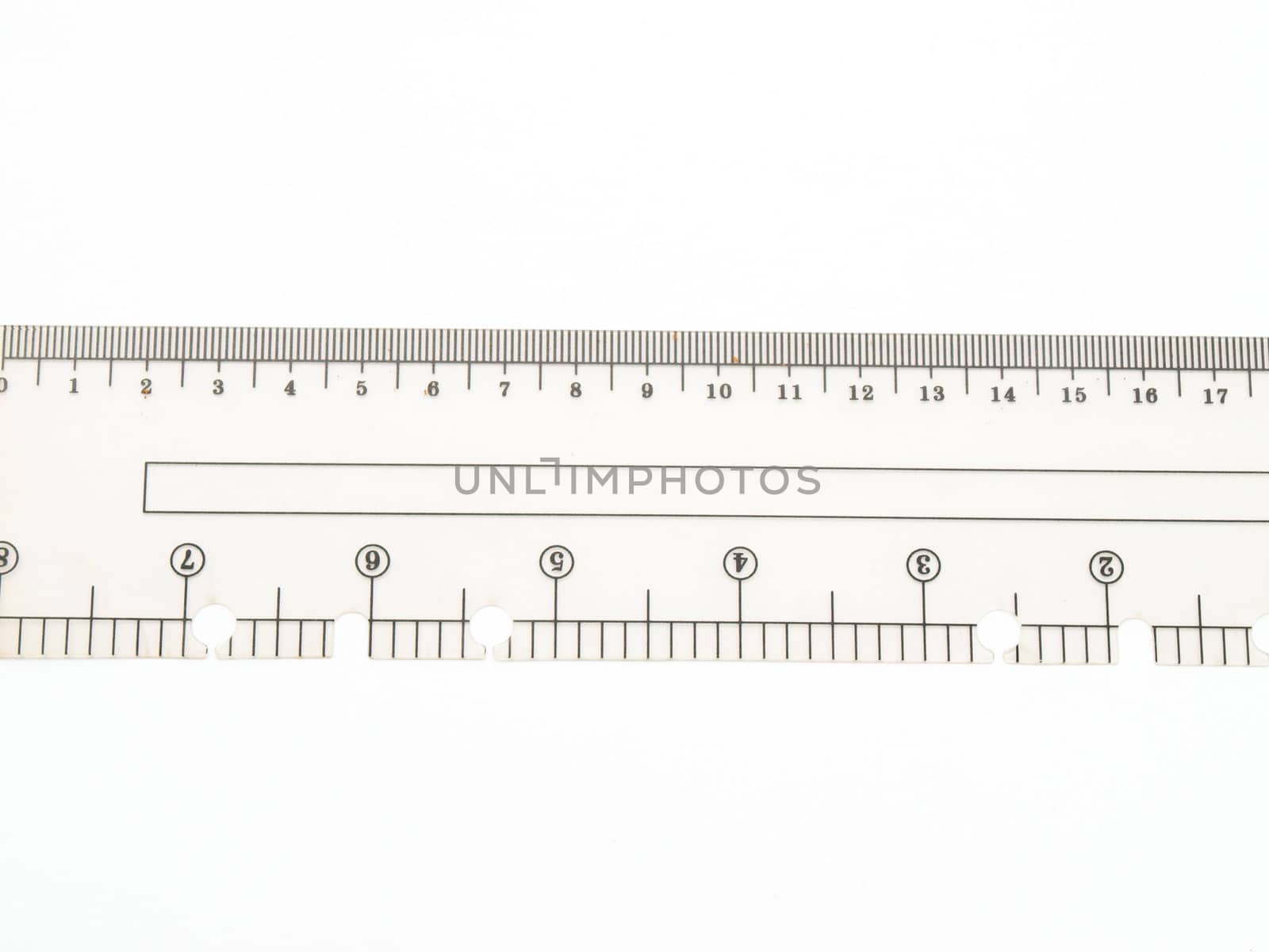 Closeup of used plastic ruler isolated on white background