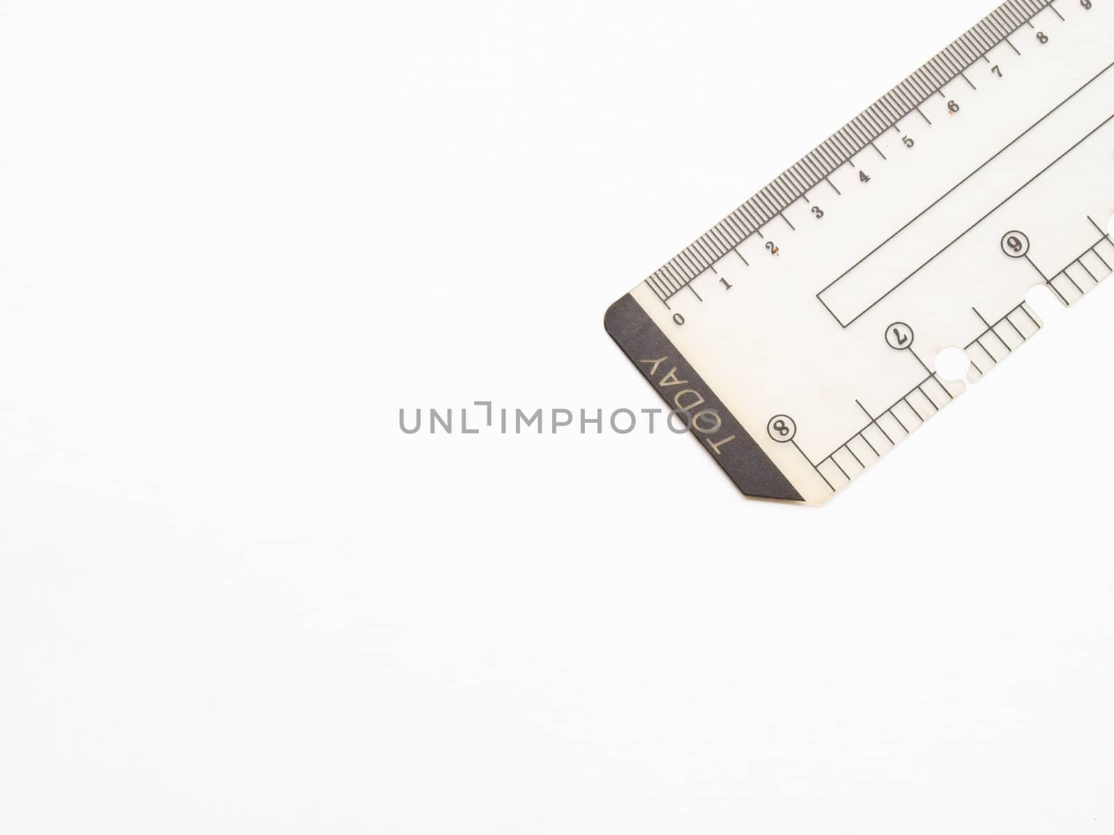 Closeup of used plastic ruler isolated on white background