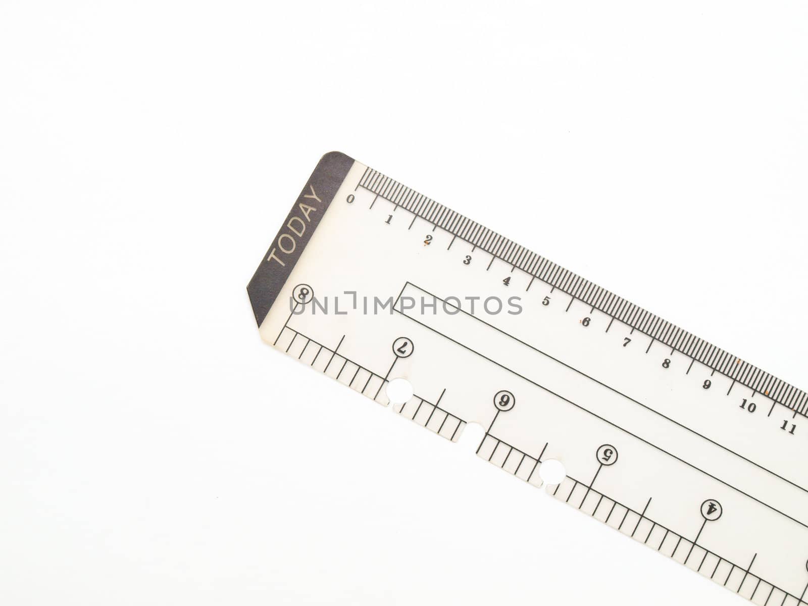 Closeup of used plastic ruler isolated on white background
