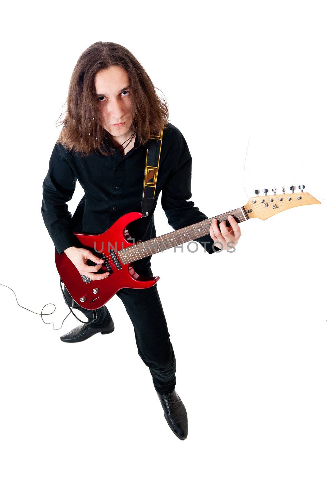 Young guitarist with red guitar on white background