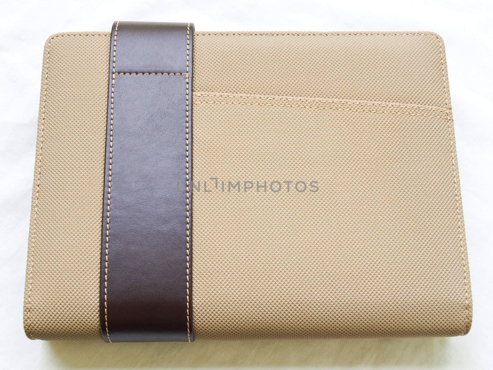 Light brown leather organizer isolated on white