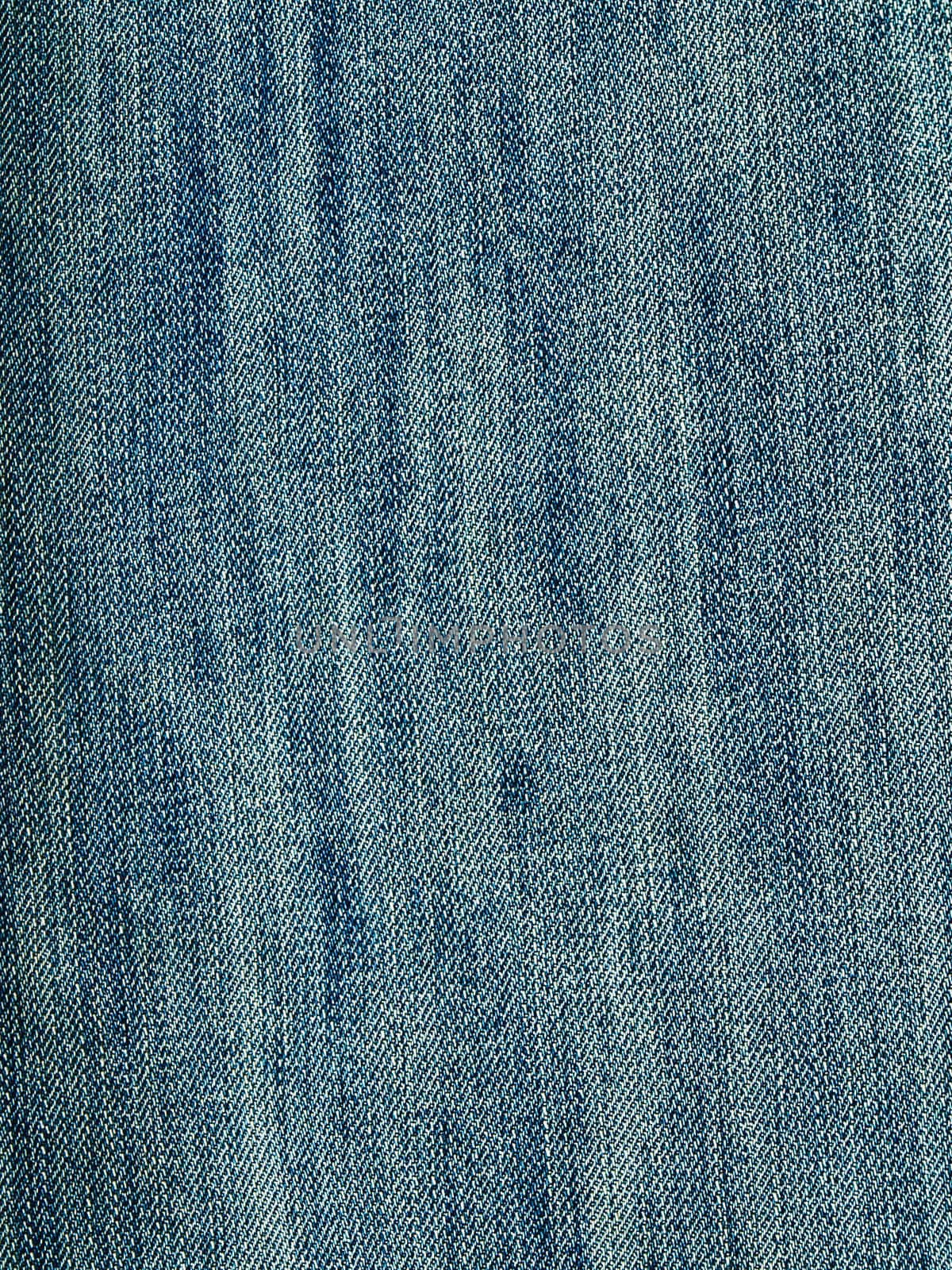 Striped textured used blue jeans denim fabric grunge background