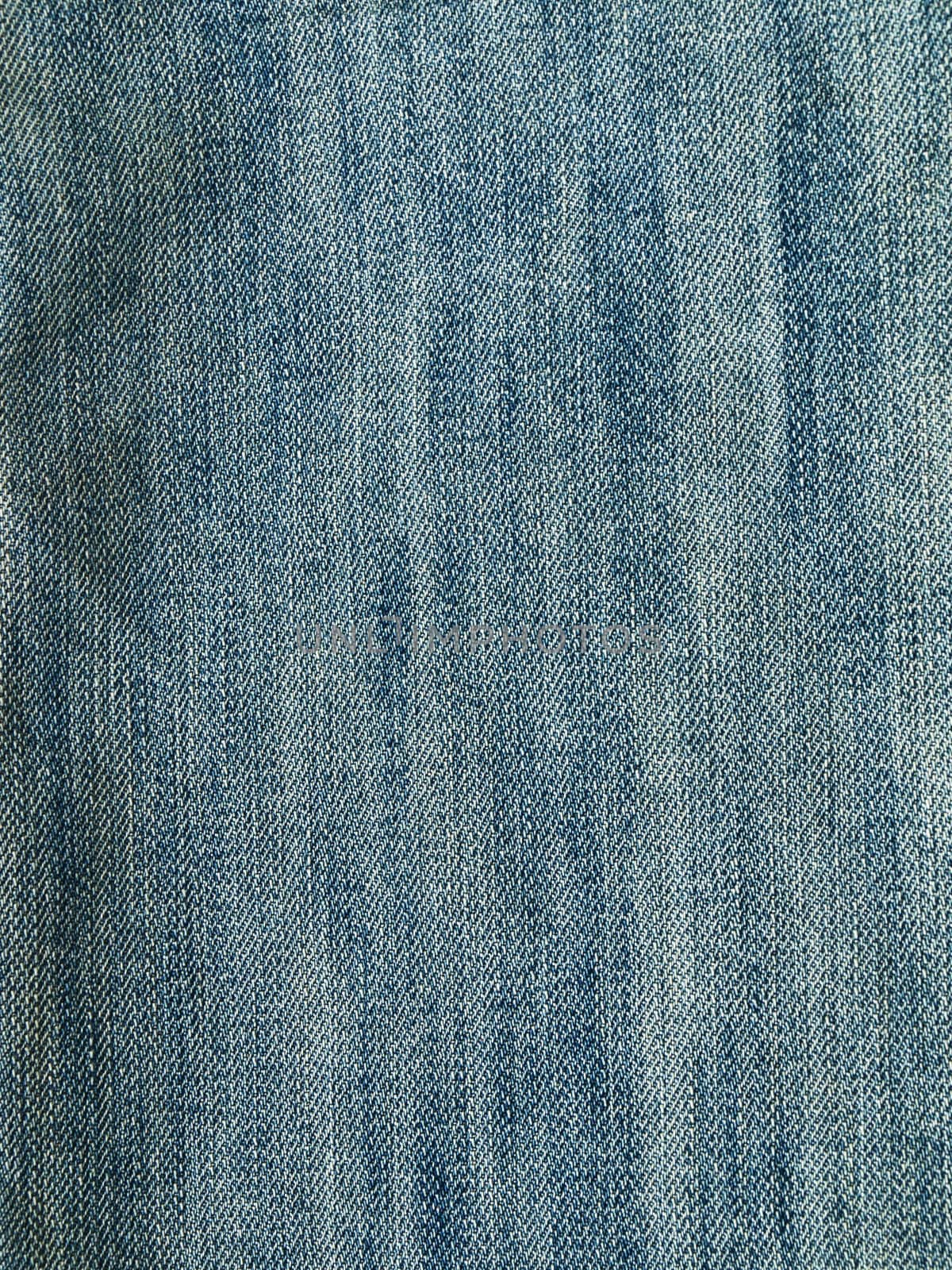 Striped textured used blue jeans denim fabric grunge background