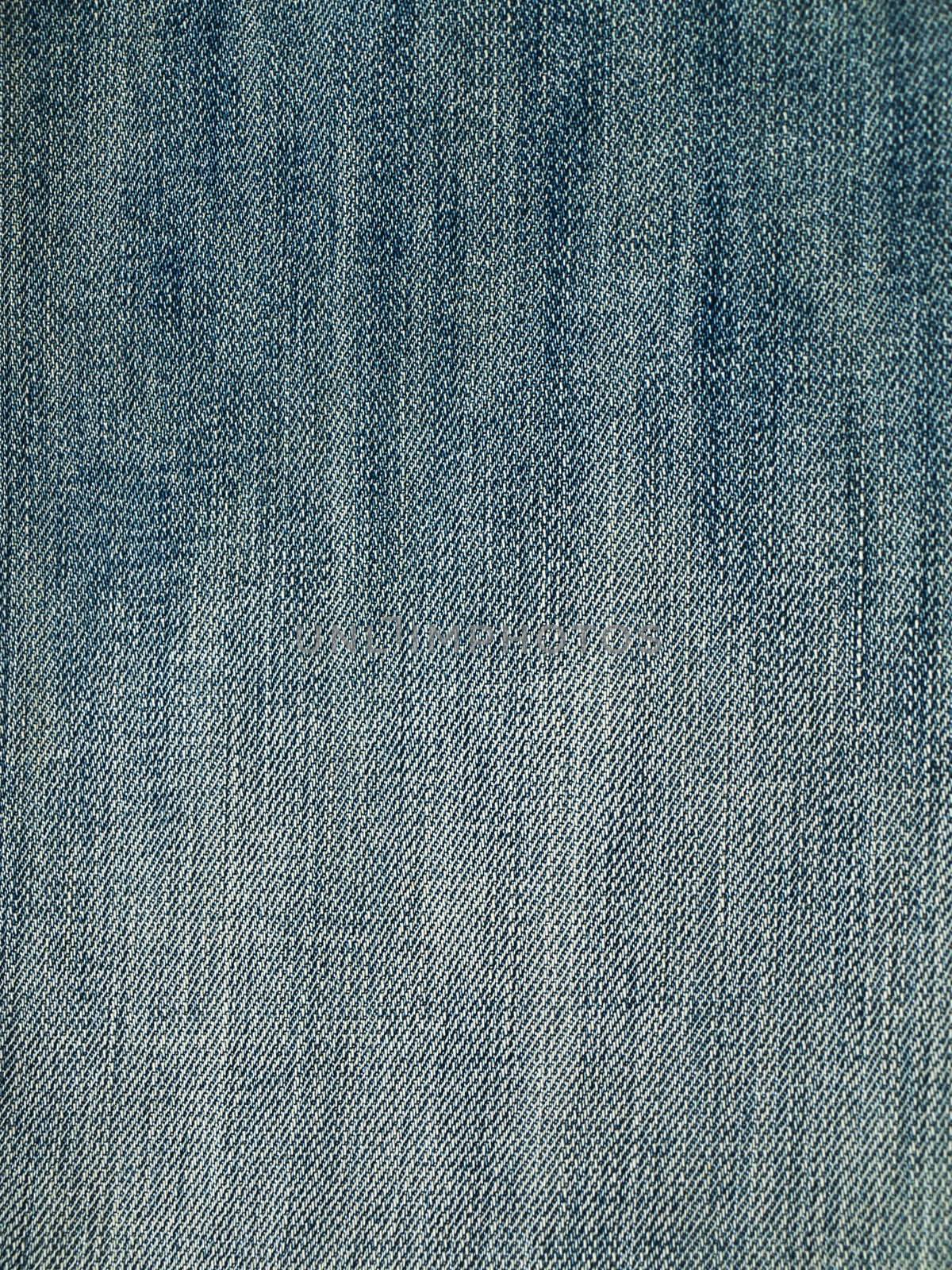 Striped textured used blue jeans denim fabric grunge background