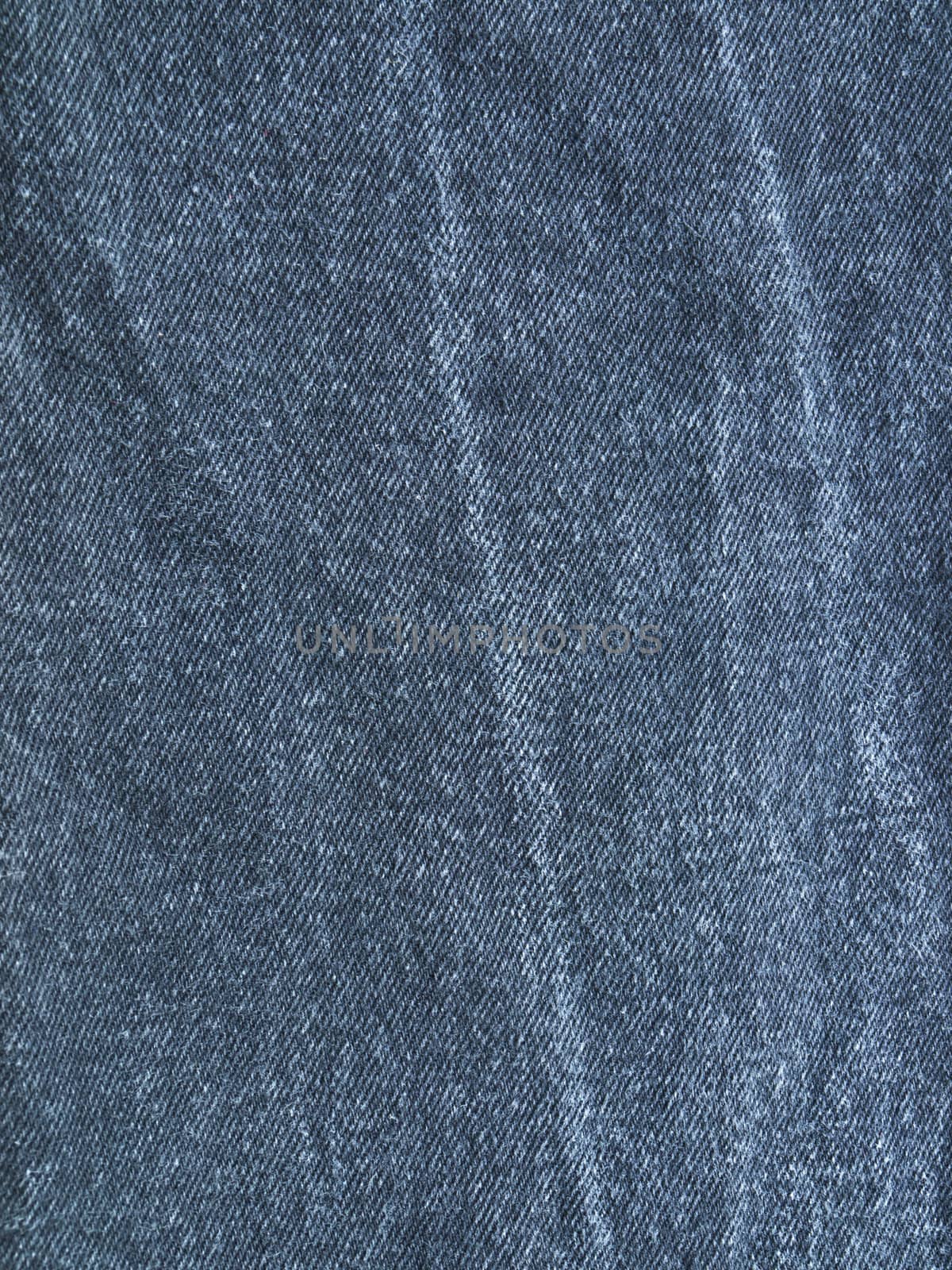 Striped textured used blue jeans denim fabric grunge background