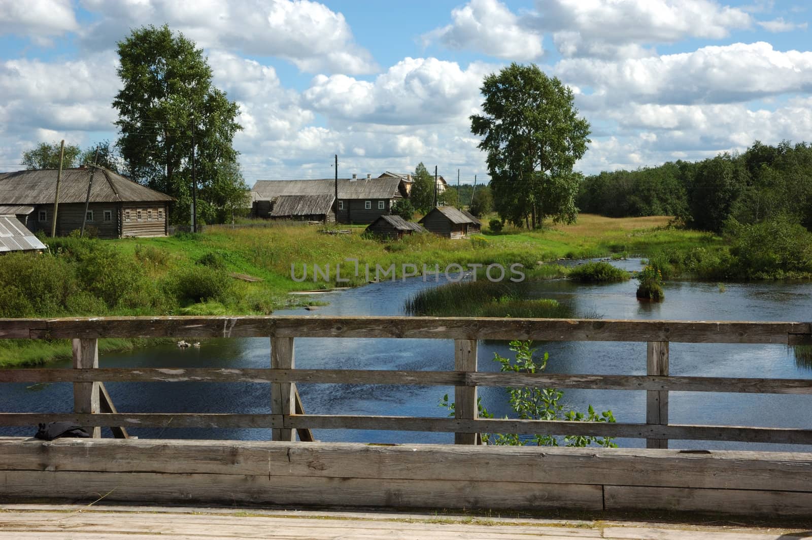 View to small Village from wooden bridge by wander
