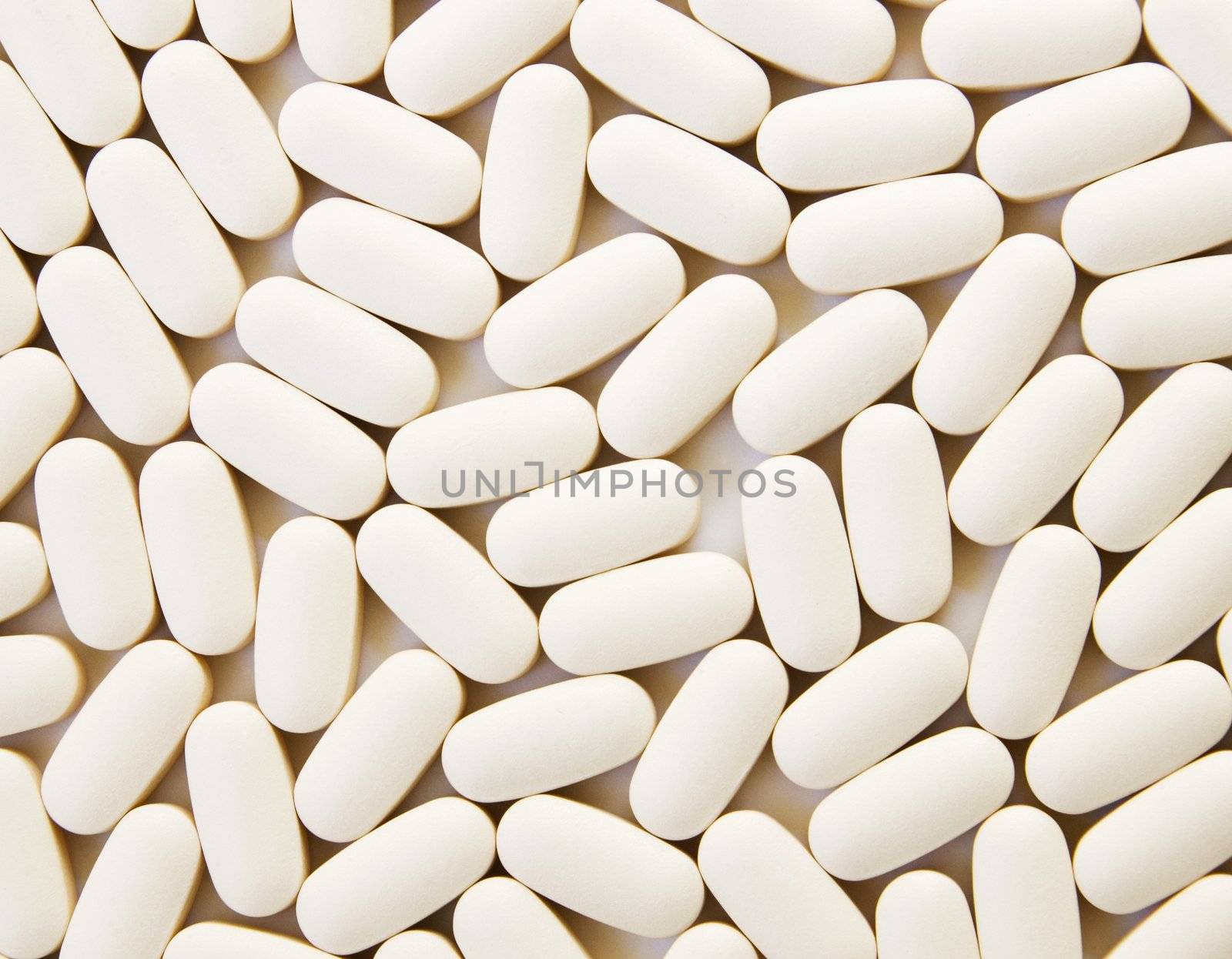 Daily Vitamins on a White Background Fill the Shot.