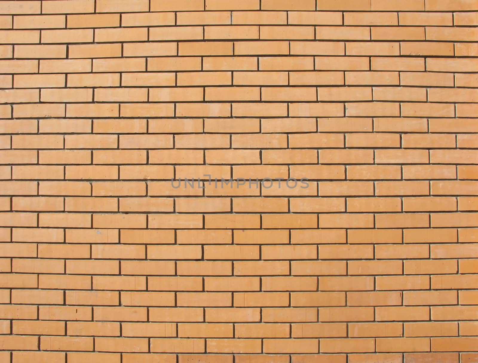 Beige colored fine brick wall texture