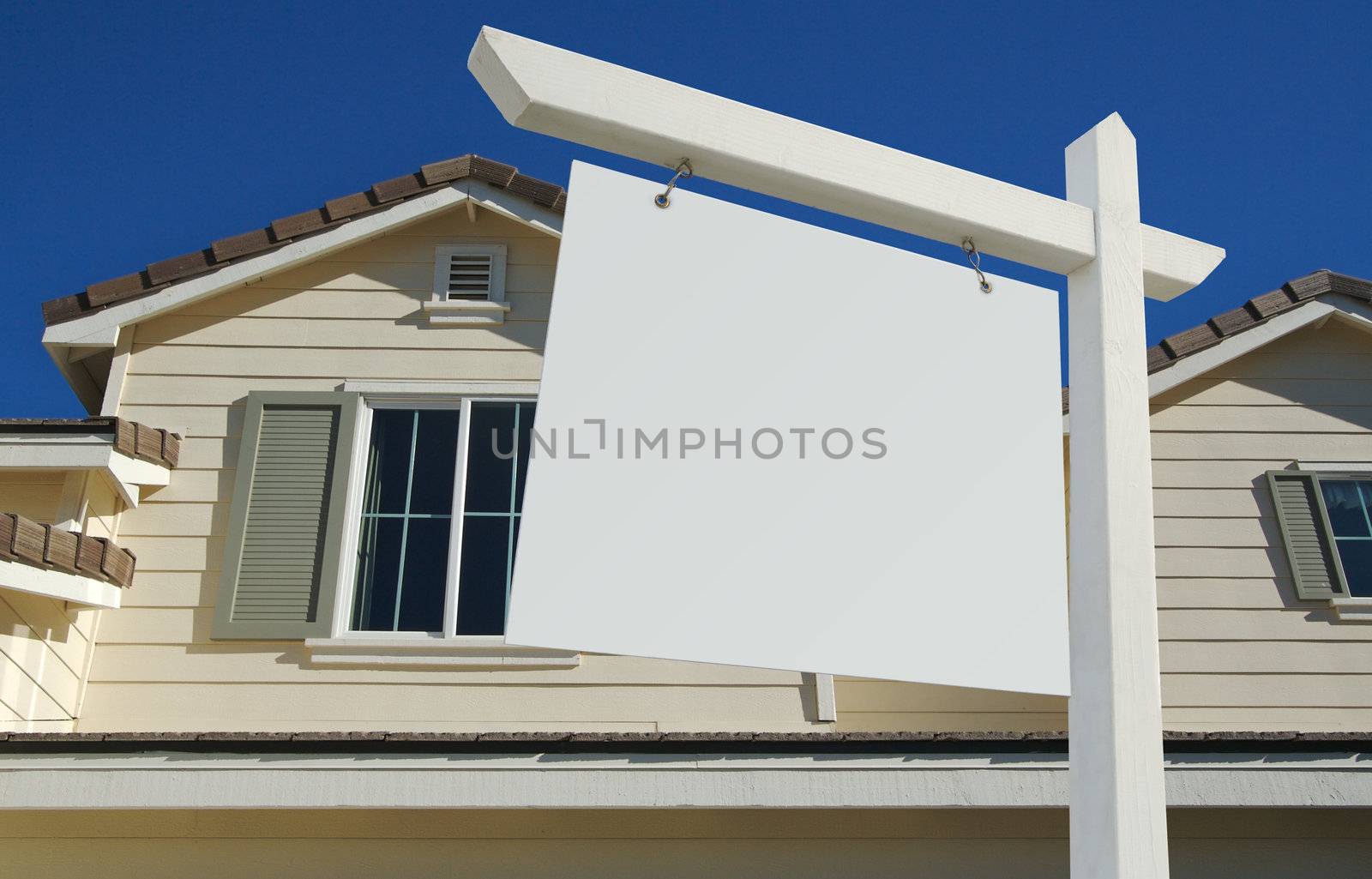Blank Real Estate Sign in Front of Beautiful New Home