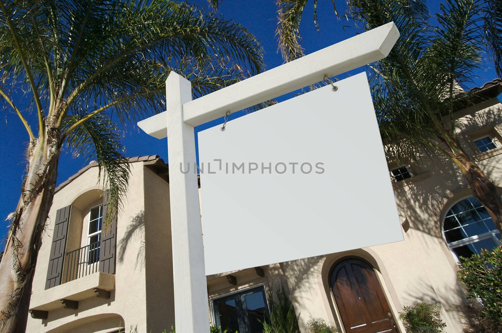 Blank Real Estate Sign in Front of Beautiful New Home