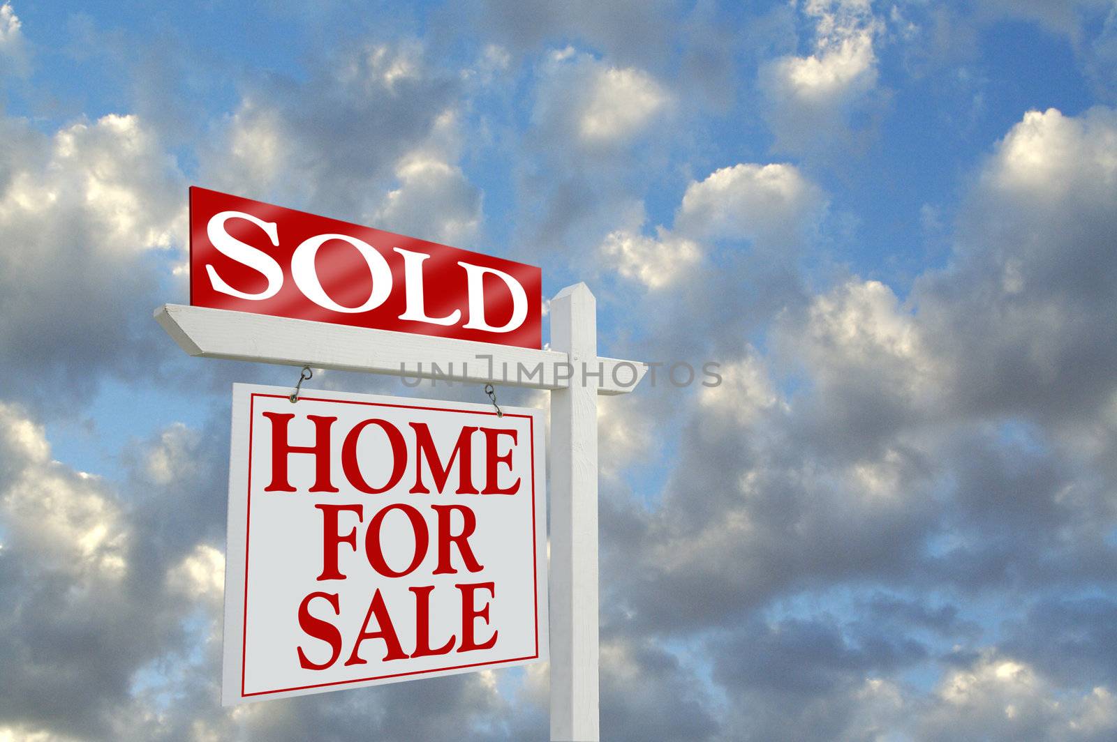 Sold Home for Sale sign on dramatic clouds background with room for your message